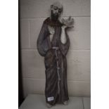 A polychrome wooden figure of St Francis of Assisi