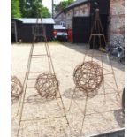 A pair of metal pyramid garden plant frames with ball finials (2)