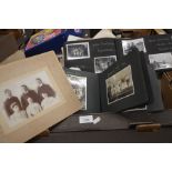 A box containing numerous Victorian and later photographs, loose and in albums