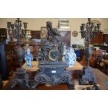 A large French spelter figural twin-train mantel clock with garniture pair of five sconce