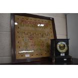 A mahogany framed stitch-work sampler and a marble and slate mantle clock (2)