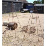 A pair of metal pyramid garden plant frames with ball finials (2)