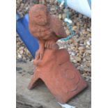 A composite terracotta owl ridge tile