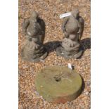 A pair of weathered cast stone-crete eagles to/w a small stone mill wheel (3)