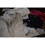 Two boxes of assorted table and bed linen to include napkin sets etc., to/w two vintage handbags and