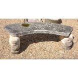 A curved stone garden bench with a pair of griffin cast composite pedestal supports