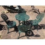 A Victorian style cast alloy green painted terrace set, comprising a table and four chairs (5)