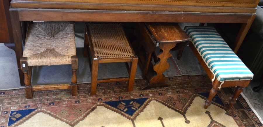 An oak framed rush seated stool to/w cane worked stool (2)