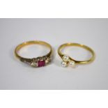 A ruby and diamond ring and a pearl set ring