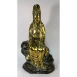 A Chinese brass figure of Guanyin