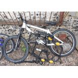 A hardtail mountain bike and folding bike rack