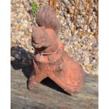 A small cast composite terracotta squirrel ridge tile