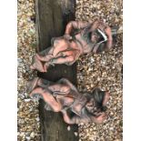 A pair of cast terracotta bearded gentleman wall mounting figures