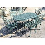 A green painted metal garden table to/w set of six foliate cast chairs, 4 standard and 2 carver
