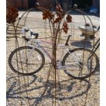 A pair of dumpy ball head garden obelisks