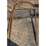 A bundle of ten large curved metal garden plant frames