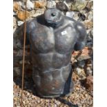 A cast composite bronzed male torso