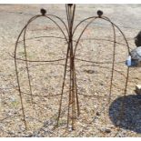 A pair of low-dumpy ball head garden obelisks