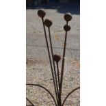 A set of five ball head garden ground spikes