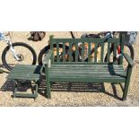 A green painted slatted teak garden bench to/w folding steamer chair and small square side table