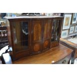 A late 19th/20th century inlaid satinwood/kingwood serpentine form part glazed wall cabinet