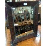 An 18th century pollard oak cushion framed easel mirror