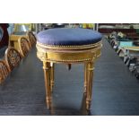 A Continental giltwood and gesso circular piano/dressing stool