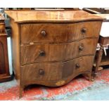 A Georgian mahogany serpentine commode chest of three long drawers