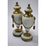 A pair of ormolu-mounted alabaster garniture urns