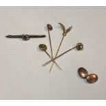A collection of antique stick pins