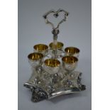 A Victorian silver and parcel gilt egg-cup stand with six cups