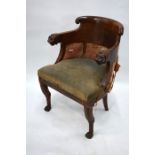 A George III mahogany library elbow armchair