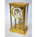 Garrard & Vignon, Paris, a late 19th century lacquered brass framed four-glass clock