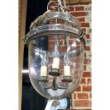 A good quality gilt metal mounted clear glass hanging light fitting