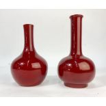 Bernard Moore - Two red flambe bottle vases