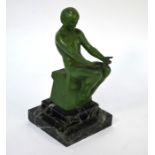 After Max Le verrier (1891-1973) a French Art Deco green painted figural table lamp