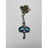 An Arts & Crafts silver and enamel pendant