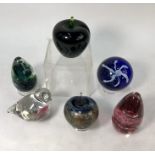 Six assorted glass paperweights