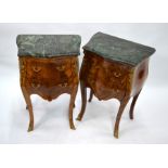 A pair of continental gilt mounted green marble top, serpentine form two drawer commode chests