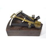 A 19th century ebony and brass octant with inset ivory scale and other mounts