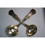 A pair of William IV silver sauce ladles