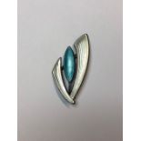 Aksel Holmsen - A Norwegian silver and enamel stylised brooch