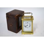 A French lacquered brass cased carriage clock