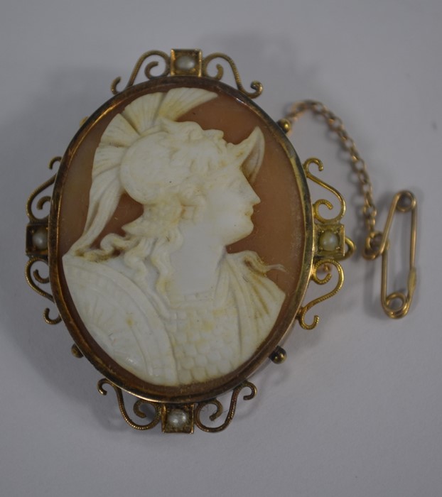 A Victorian oval shell cameo brooch featuring Mars