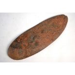 A ceremonial stone hand-axe or club with incised decoration