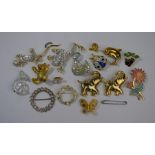 A collection of gilt-metal costume jewellery brooches