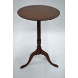 A George III mahogany circular top tripod occasional table