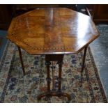 A Victorian ebony and satinwood banded figured walnut Sutherland table