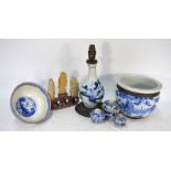 A Chinese blue and white bottle vase, thee tea bowls, jardiniere and sanxing group
