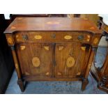 A 19th century continental inlaid mahogany cabinet